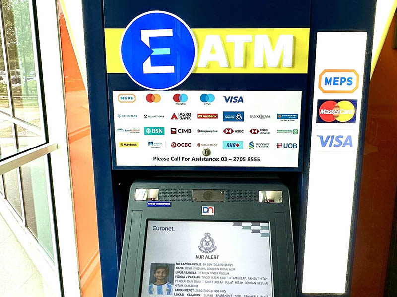 ATM screen in Malaysia displaying a missing child alert as part of Euronet’s support of the NUR initiative.