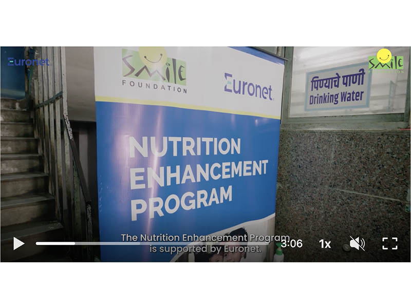 A sign promoting the Euronet and Smile Foundation initiative.