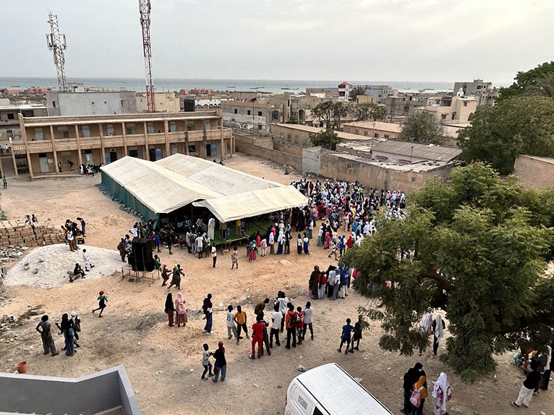 Ria team celebrating with students and locals at the inauguration of Bargny High School’s new computer room in Senegal.