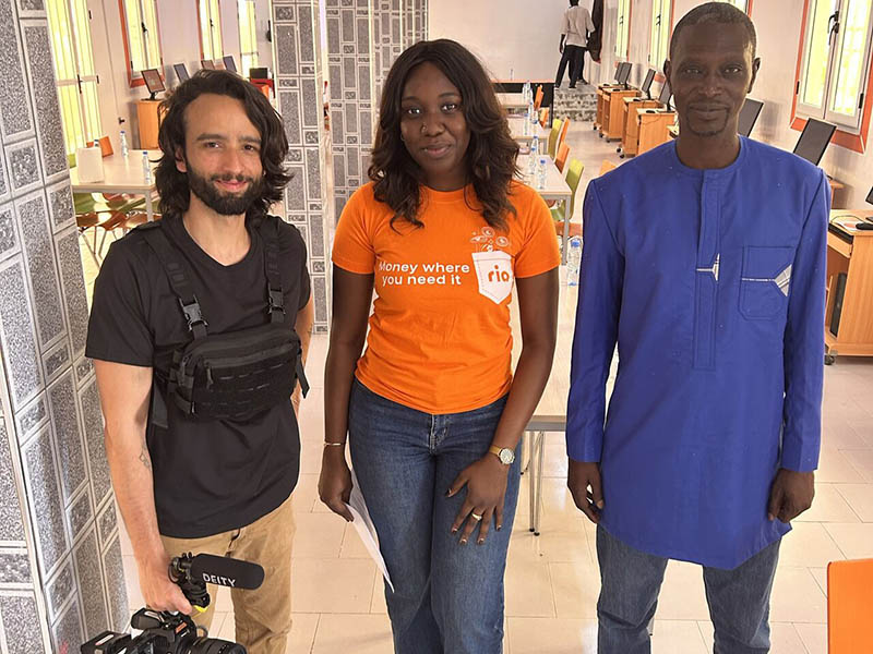 Ria team celebrating with students and locals at the inauguration of Bargny High School’s new computer room in Senegal.