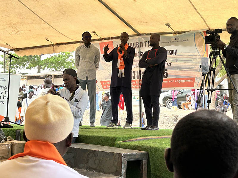 Ria team celebrating with students and locals at the inauguration of Bargny High School’s new computer room in Senegal.