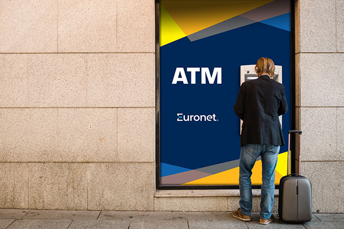 A man using a Euronet ATM