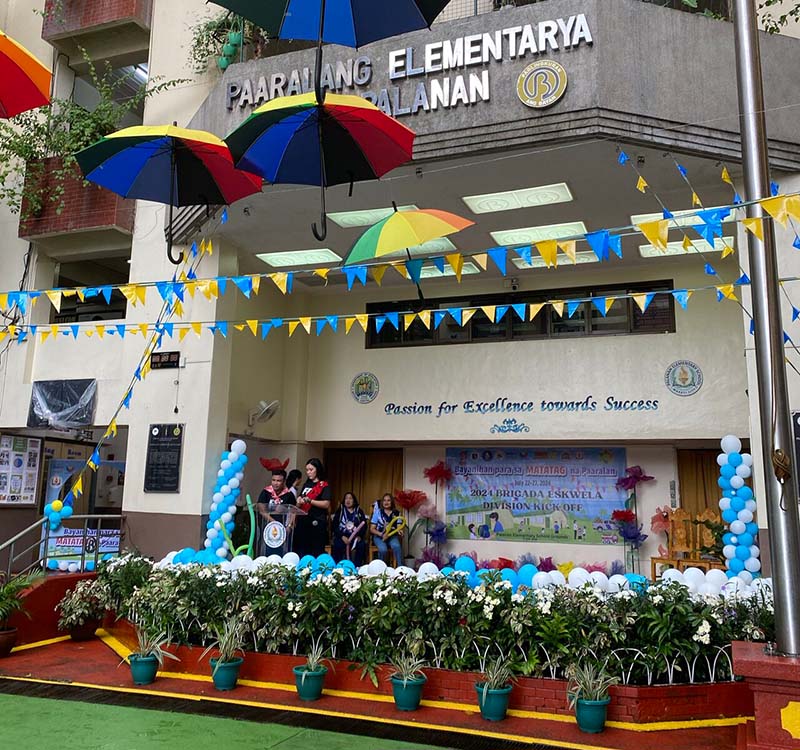 Ria employees donate cleaning products to school in the Philippines.