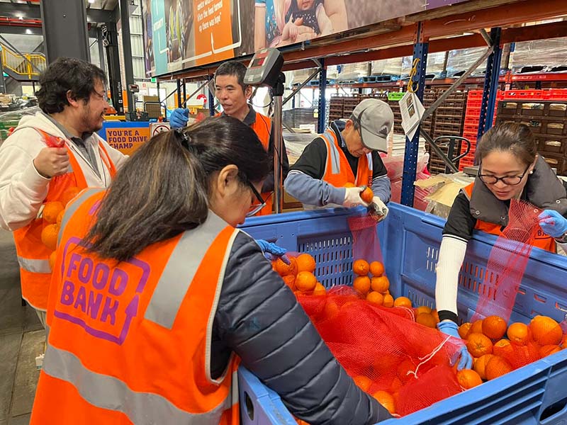 A photo of Euronet employees volunteering at Foodbank Australia