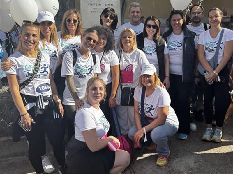 A photo of the Euronet team participating in Greece Race for the Cure event to raise breast cancer awareness.