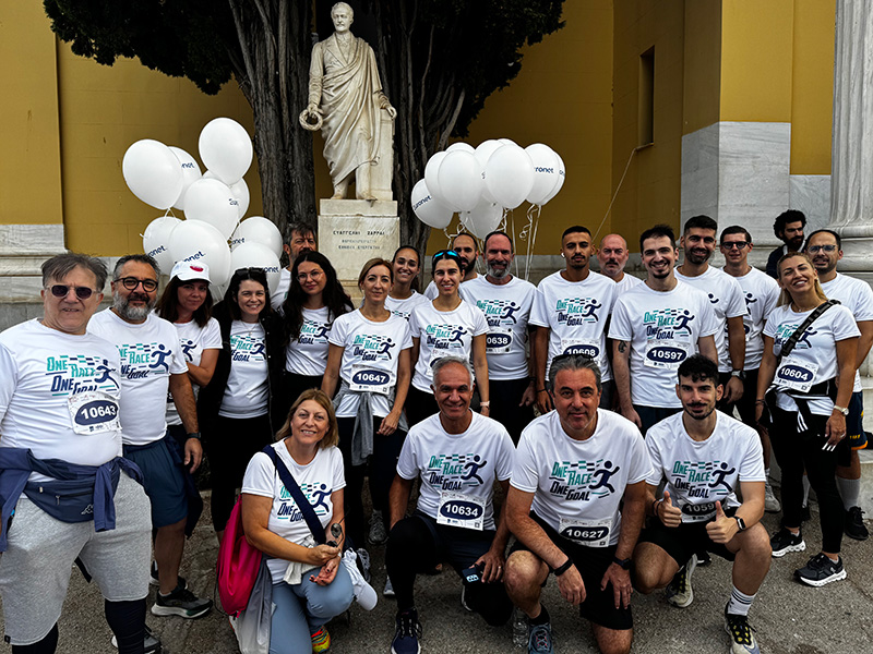 A photo of the Euronet team participating in Greece Race for the Cure event to raise breast cancer awareness.
