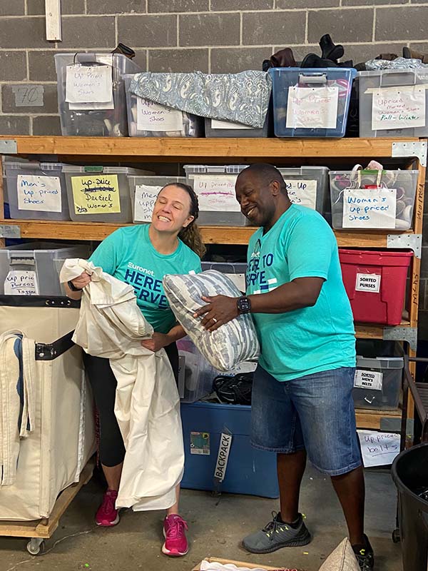 An image of Euronet employees helping at Catholic Charities Kansas City in 2023.